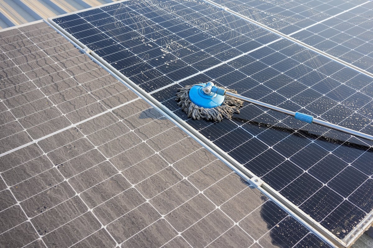 Professional solar panel cleaning using waterfed brush system