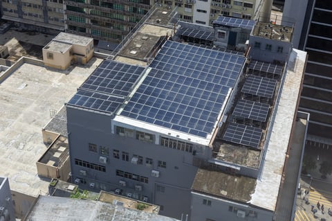 Factory rooftop covered with solar panels